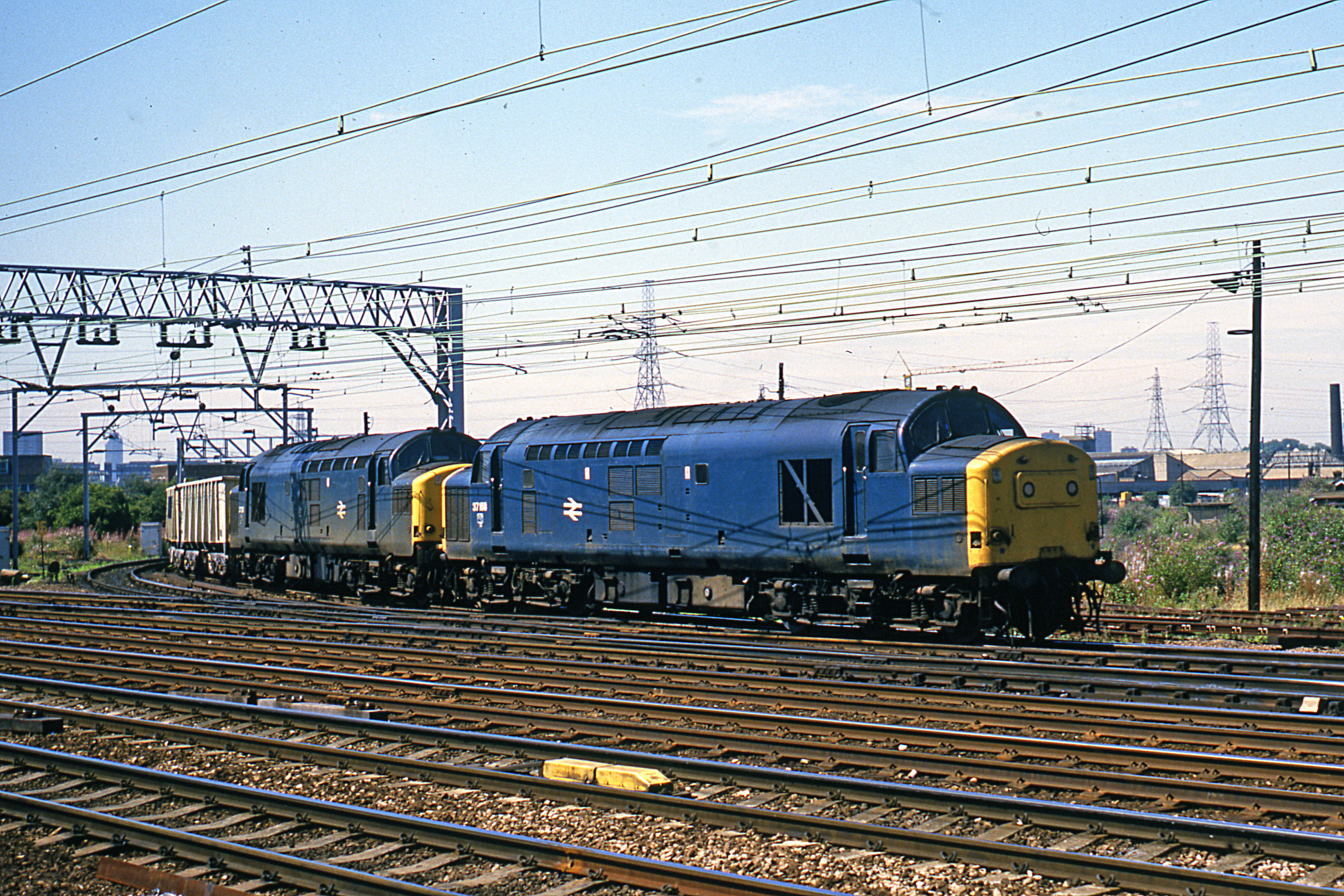37168 double-heading a stone train at Stratford in August 1986. Colour-Rail.com