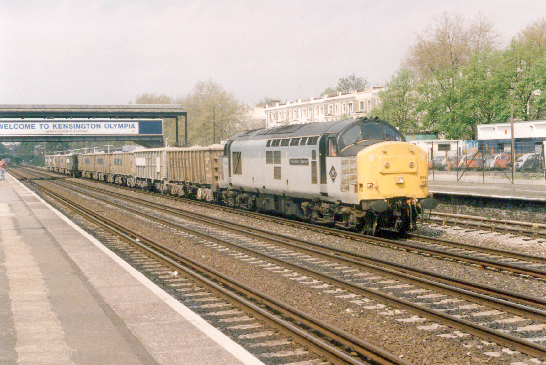 37890 hauling 7O02 12.40 Acton to Woking loaded stone at Kensington Olympia, 27th April 1995. John N Smith
