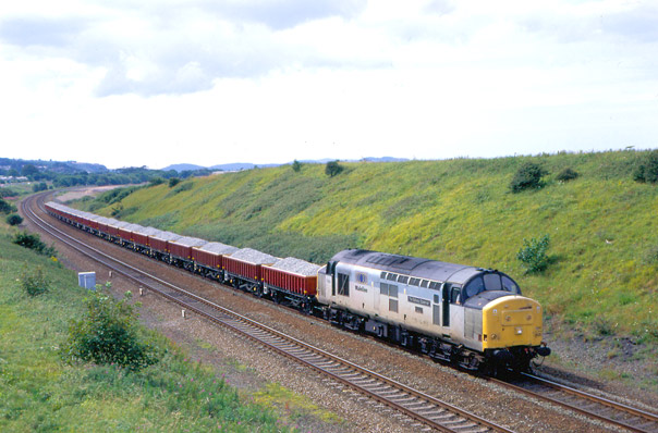 37890 near Llandulas with 7L31 12.50 Penmaenmawr to Guide Bridge loaded engineers’ train, 25th July 1998. Dave Peachey