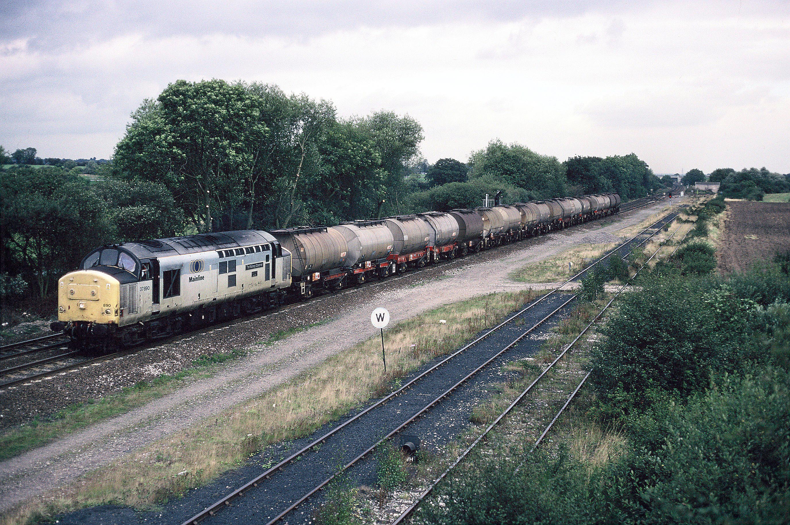 37890 at Stenson Junction with Hull to Baglan Bay acetic acid tanks, 18th September 1998. Bob Wallen
