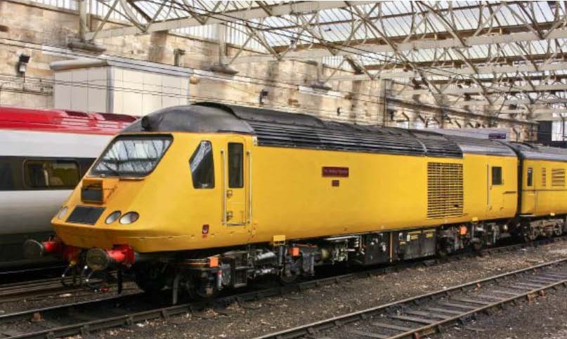 43014 The Railway Observer in unbranded Network Rail yellow livery at the rear of the NMT in Carlisle at 14.24 on Monday 21st July 2014. The rear light appears to be illuminated.  Probably a Heaton-Carlisle-Derby working. Alan Lovecy