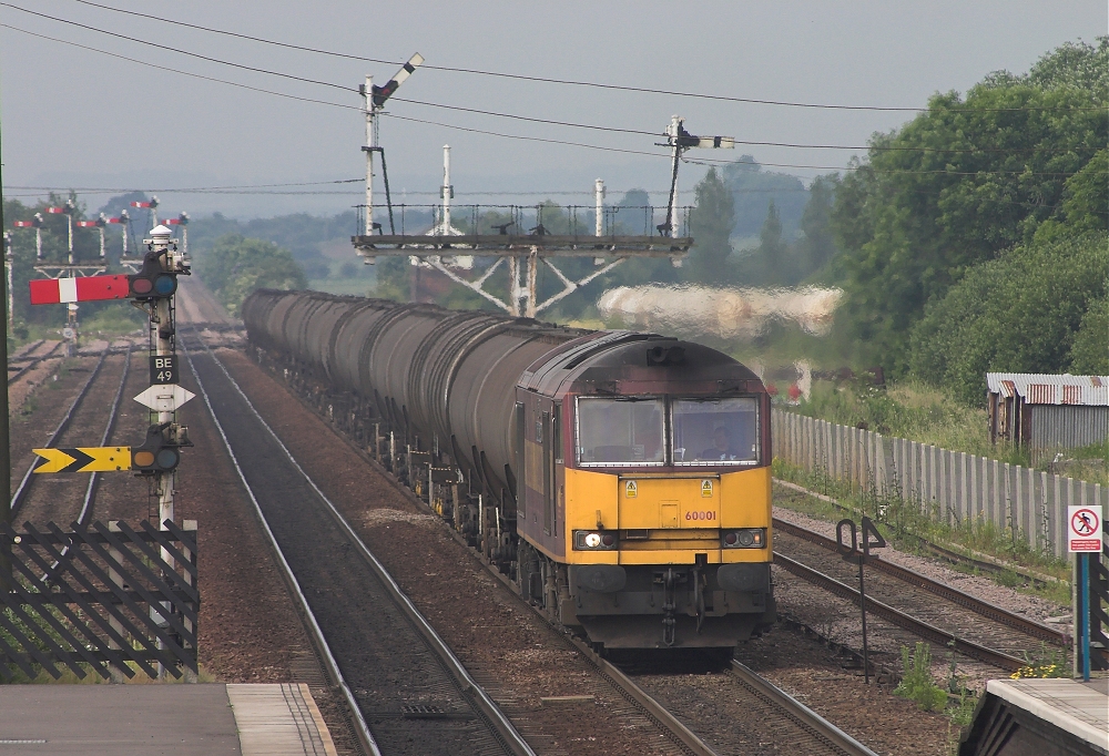 60001 through Barnetby with 6E46 Kingsbury to Lindsey oil terminal empty bogie oil tanks, 24th June 2005. Marvin Peanuts