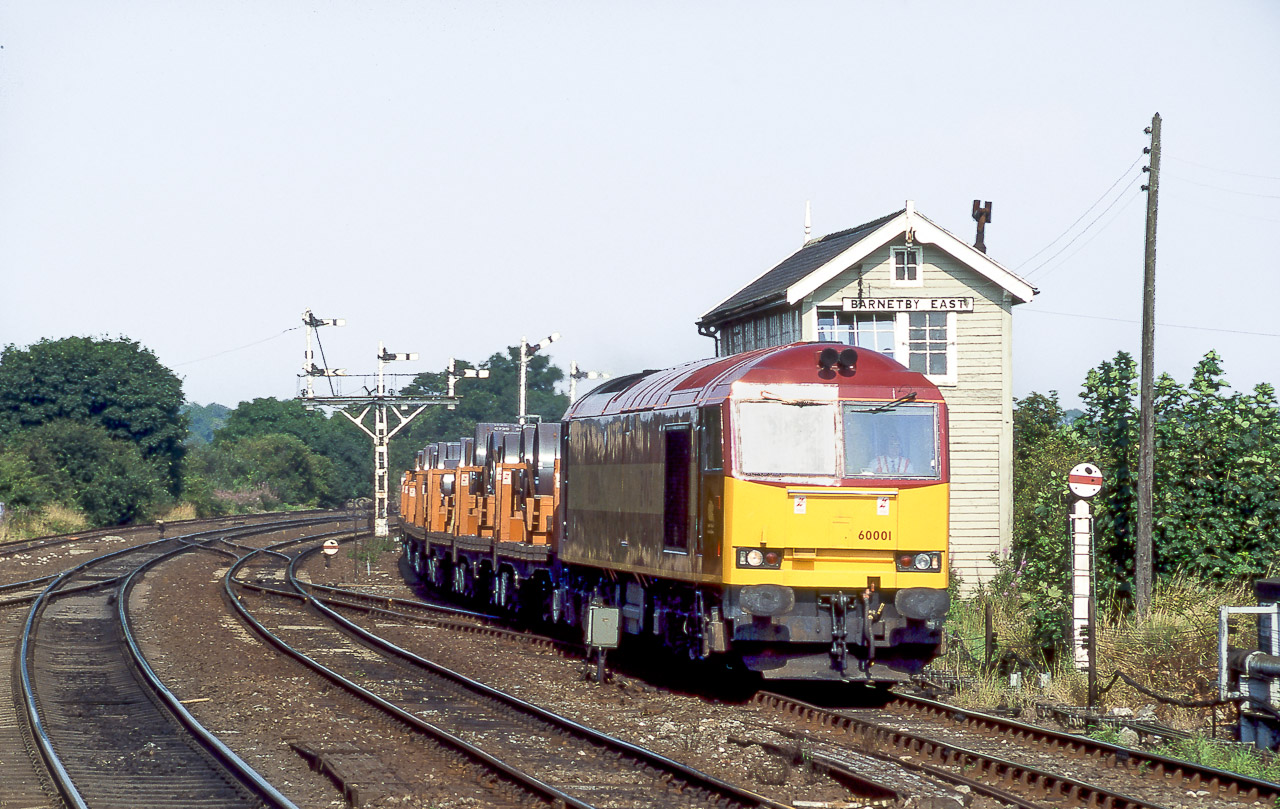 60001 passing Barnetby East box with a loaded steel coil train on 9th August 1997. With the sun reflecting of the windscreen it suggests a late afternoon working. Keith Sanders