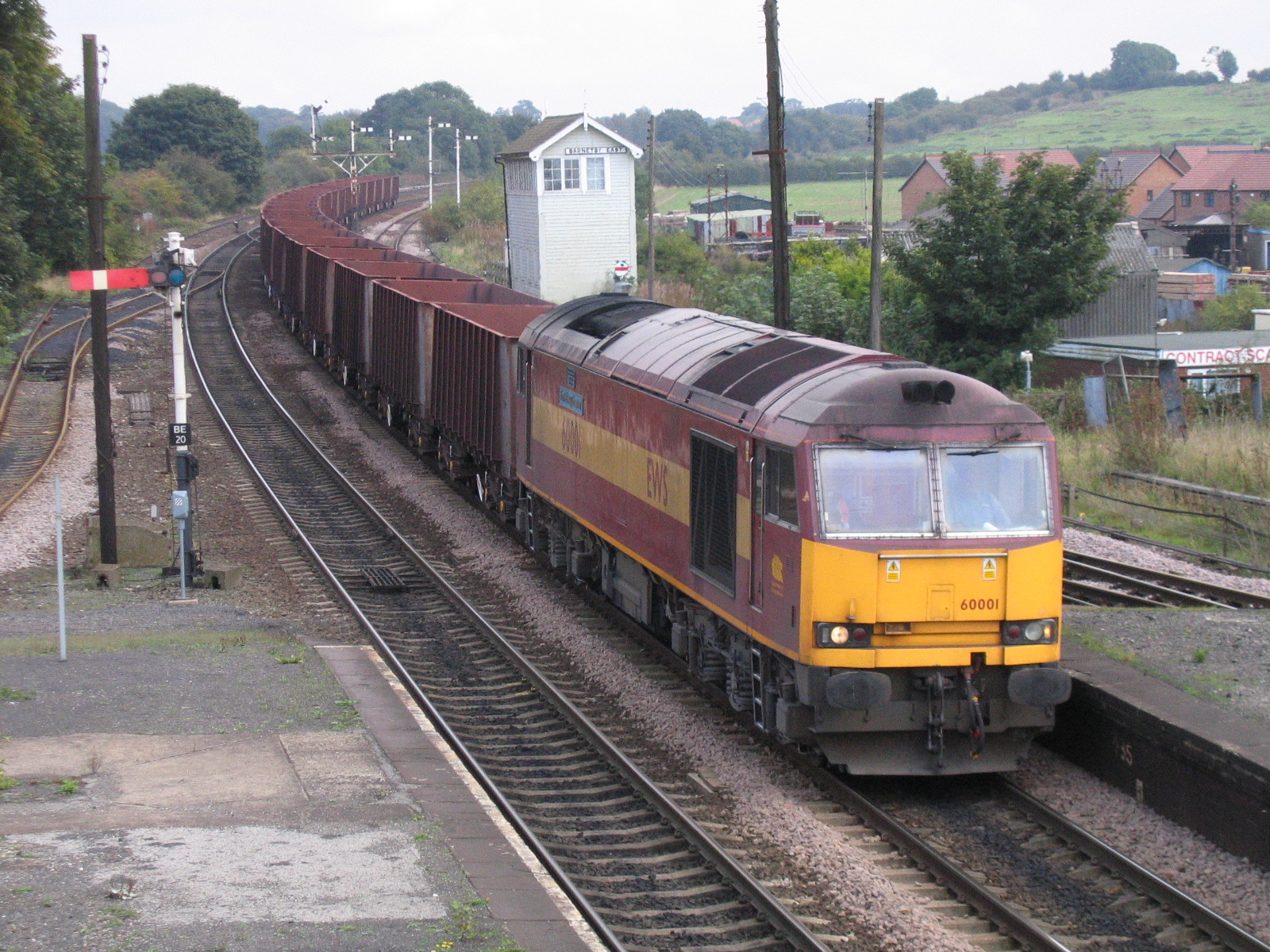 60001 with 6T24 Immingham to Corus Santon loaded iron ore tipplers passes Barnetby East signal box, 5th October 2005. Andy Middlemass