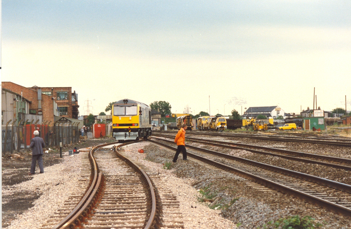 60001 goes onto British Rail metals for the first time; just visible on the left are the Traction drawing offices with several staff members watching the departure of the locomotive which they designed, 30th June 1989. Craig Simmons