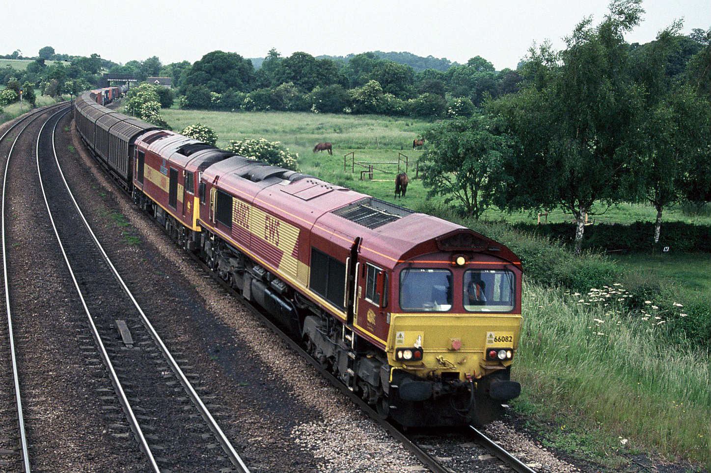 66082, with 60001 DIT, through Melton Ross on 6D65 Doncaster Belmont yard to Immingham Enterprise, 18th June 2005. Bob Wallen