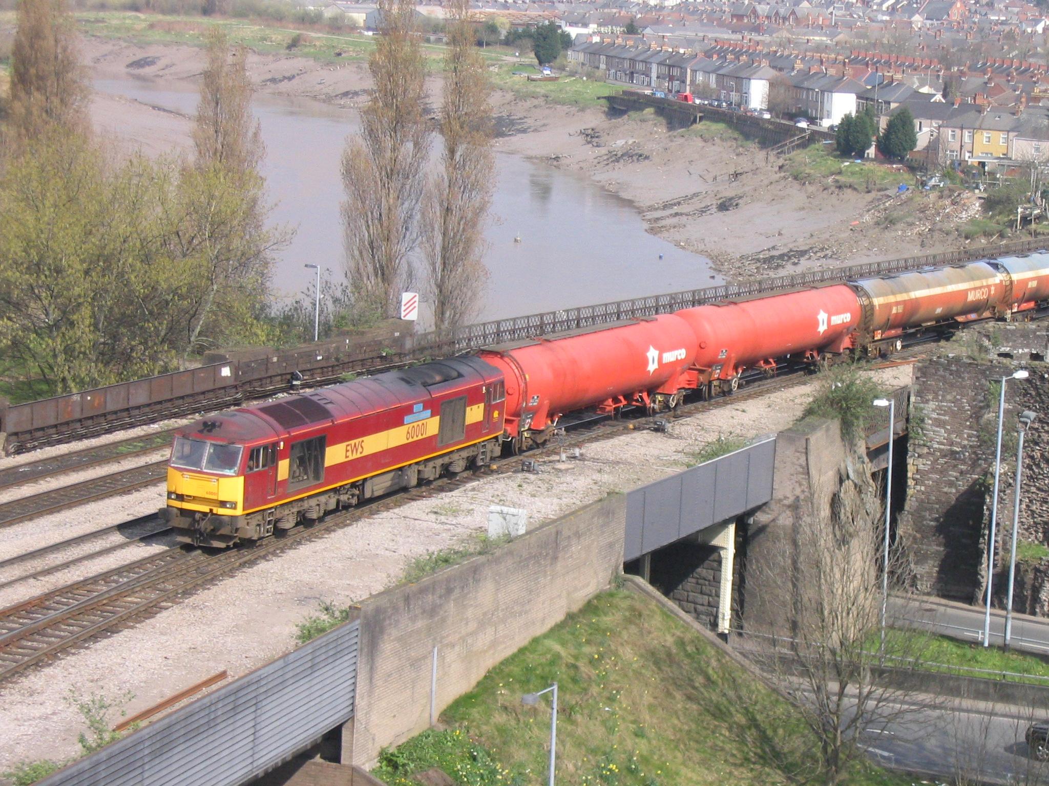 60001 crossing the River Usk east of Newport station with 6B28 Westerleigh to Margam empty Murco bogie oil tanks, 26th March 2005. Dave Campbell