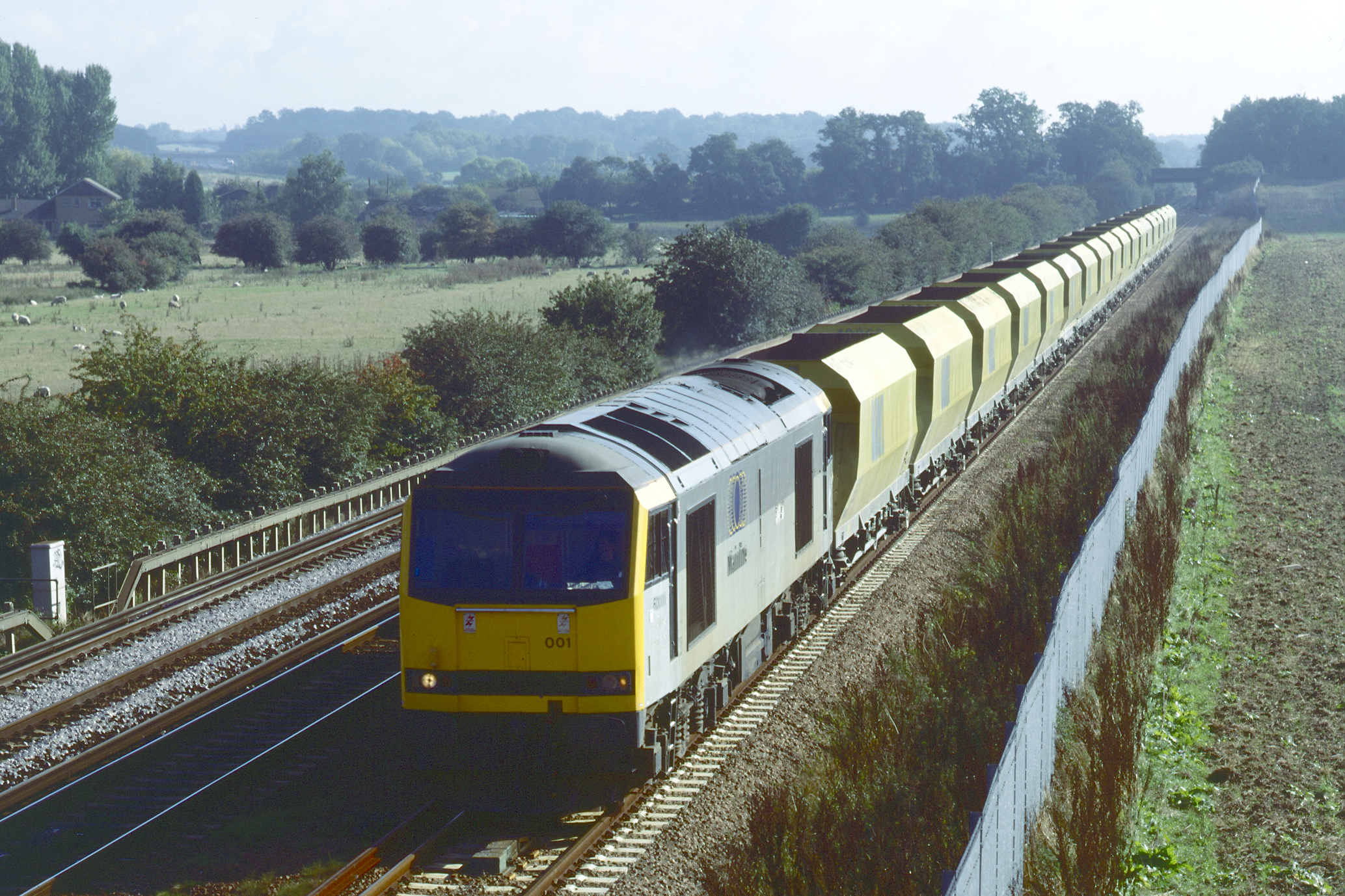 60001 passes Otford Junction with the 10.34 Hothfield to Acton Yard empty stone hoppers on 1st October 1996. Rodney Lissenden